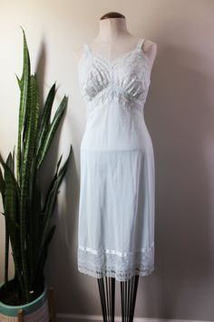 Vintage Nightgown With Delicate Lace For Wedding Night, Vintage Lace Trim Slip Dress For Sleep, Vintage Slip Dress With Lace Trim For Sleep, Bedtime Lace Slip Dress With Lace Trim, Fitted Vintage Sleepwear With Lace Trim, Vintage Camisole Sleepwear, Vintage Camisole Sleepwear For Bedtime, Vintage Lace Camisole Sleepwear, Vintage Sleeveless Lace Nightgown