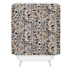 a shower curtain with blue and brown flowers on the outside, in front of a white background