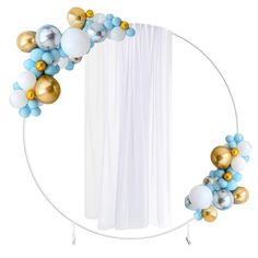 a white circle with blue, gold and silver balloons hanging from it's sides