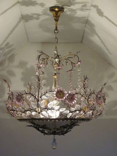 a chandelier hanging from the ceiling in a room