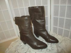 Genuine leather boots by Showoffs are from the 1980's. Size 9 M. Dark brown. Made in Italy.  Man made sole.  Textile lining.  2" stacked heel. Pull on. The can be cuffed or worn up.  11 1/2" shaft all the way up and can be cuffed to 8".  Very good condition. Light sole wear. The uppers have a few minor surface scuffs. The heel plates in the back are worn down a bit.  I ship same or next business day. Vintage Wide Calf Mid-calf Boots For Winter, Vintage Wide Calf Mid-calf Boots For Fall, Vintage Winter Boots Medium Width, Vintage Winter Mid-calf Boots With Pointed Toe, Vintage High Ankle Mid-calf Boots For Winter, Genuine Leather Boots, All The Way Up, Bear Print, Stacked Heel