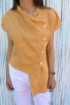 "DETAILS:- - Asymmetric Linen Shirt - Cowl Neck - Designer collar with Shell Buttons - 100% Lightweight Linen - Customization Available For more products here is the link to my shop ---------------------------------------- https://www.etsy.com/in-en/shop/PehroDesign ---------------------------------------- ★★All the outfits are MADE TO ORDER you can share your demand for any kind of changes before placing your order ★★ ----------------------------------------------------- ★★ Very Comfortable Fab Linen Top Women, Linen Tunic Dress, Blouse Summer, Dress Asymmetrical, Simple Top, Cowl Neck Top, Linen Blouse, Asymmetrical Hem, Linen Top