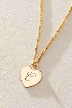 Just as effortless as it is elegant, this stunning necklace features a heart-shaped pendant with gorgeous cursive engraved initial for the ideal finishing touch. * 14k Gold Filled wheat chain * Personalized, laser engraved, 14k Gold Filled 12x14mm heart charm * Length: 18" * 5 days of production | Set & Stones Personalized Alice Necklace at Free People in Gold Elegant Nameplate Initial Necklace For Anniversary, Elegant Initials Charm Necklace, Elegant Engraved Nameplate Initial Necklace, Elegant Personalized White Gold Initial Necklace, Elegant Initial Pendant Necklace For Mother's Day, Elegant Sterling Silver Nameplate Initial Necklace, Classic Mother's Day Charm Necklaces With Initial Pendant, Elegant Initial Necklace With Charms As Gift, Elegant Initial Necklace With Charms For Mother's Day