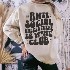 This sweatshirt is perfect for those who are anti-social until the wine is flowing. Perfect for a wine tasting trip to Napa or Italy ️. Great gift for that special person who loves vino, and might not be the biggest social butterfly....we all now one! Check out all our trendy apparel & gift items at https://bellawarriorboutique.etsy.com **Enjoy FREE SHIPPING ON ORDERS OF $35 OR MORE as our thank you for purchasing from Bella Warrior Boutique. Thank you, thank you, THANK YOU ‼️Production and ship Drinks Outfits, Wine Club, Funny Wine, Warrior Spirit, Club Sweatshirts, Social Butterfly, Wine Humor, Wine Clubs, Wine Lover