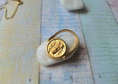 "Double Face Coin Ring made of 925 sterling silver coated with 14k gold layers. Dainty ring designed based on the ancient greek symbol \"Medusa \" and Pallada.  Appropriate either for everyday or formal looks. Also available in 925 Sterling Silver. Find similar rings here: https://www.etsy.com/listing/770492008/phaistos-disc-opal-ring-sterling-silver?click_key=854069b5801e826735cbc91136574f854413d225%3A770492008&click_sum=da5d808d&ref=shop_home_active_11&pro=1&frs=1 https://www.etsy.com/listing/ Ancient Greek Ring, Ancient Greek Symbols, Phaistos Disc, Medusa Ring, Disc Ring, Greek Symbol, Hippy Gifts, Coin Earrings, Coin Ring