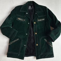 Vintage Montgomery Ward Dark Green Velvet Faux Fur Lined Coat Size Small Color: Dark Green Gold Tone Zipper Pockets Snap Button Front Closure Faux Fur Lined Fitted Winter Outerwear With Button Zip Fly, Vintage Outerwear With Faux Fur Lining And Long Sleeves, Winter Leather Jacket With Snap Buttons, Classic Long Sleeve Outerwear With Button Zip Fly, Winter Leather Jacket With Buttons, Classic Winter Outerwear With Button Zip Fly, Green Winter Outerwear With Snap Buttons, Fitted Green Outerwear With Snap Buttons, Vintage Green Outerwear With Snap Buttons