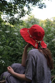 "The 'Arwen' hat is a beautiful linen sun hat perfect for long summer days in the garden and exploring nature. Made from high quality 100% natural linen in a True red colour.  The hat has French millinery wire within the brim edge to give it a perfect romantic, artisanal look, the whole look of this hat is intended to give a perfectly imperfect feel of a casual easy to wear summer hat that has a very pretty silhouette. The brim of the Arwen is also slightly A-Symmetrical thanks to the split in t Waterproof Hat, Country Hats, Happy Hat, Gardening Hat, Exploring Nature, Large Hats, Sun Protection Hat, Mulberry Paper, Sun Hats For Women