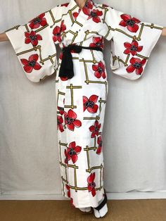 A cute vintage Yukata Kimono dress from Japan.  Made of light cotton for warm summer days.  Wear this as a dress, robe, beach cover or dressing gown.   Fits a women's size S. MATERIAL:  100% Cotton.  Unlined. PATTERN:  Oversized flowers and lattice. Color:  White with black, red & yellow design. CONDITION:  Used vintage.  A few light stains (see photos). Sash NOT included. Kimono sash sold separately. My shop: https://kimonomemoirs.etsy.com. SIZE: Women's SMALL Kimono. Wingspan- 49 inch (124.5 c Plus Size Furisode, Spring Cotton Kimono For Beach Cover-up, Spring Cotton Dress With Kimono Sleeves, White Kimono For Spring Beach Cover-up, Casual Printed White Kimono, Casual White Printed Kimono, White Spring Festival Kimono, White Floral Print Kimono For Festival, Casual White Kimono With Kimono Sleeves