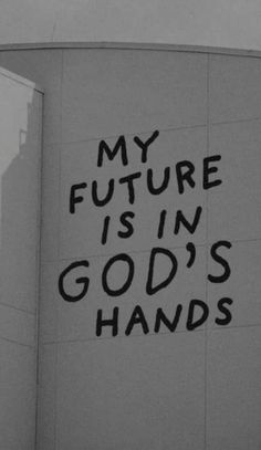 a sign on the side of a building that says my future is in god's hands