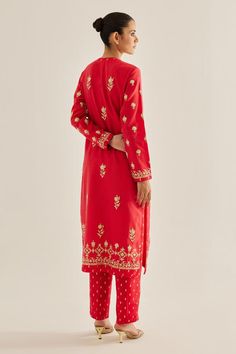 Red kurta with thread, floral, dori embroidery. Paired with trousers and dupatta.
Components: 3
Pattern: Embroidered
Type Of Work: Floral
Neckline: Round
Sleeve Type: Full
Fabric: Silk Chanderi
Color: Red
Other Details: 
Side slits
Placket detailing
Length (In inches):
Kurta: 48
Trouser: 38
Occasion: Puja - Aza Fashions Festive Red Unstitched Suit With Dabka Work, Red Unstitched Suit With Zari Work For Designer Wear, Red Fitted Churidar With Straight Kurta, Fitted Resham Embroidery Sets For Puja, Red Unstitched Churidar With Chikankari Embroidery, Unstitched Red Churidar With Chikankari Embroidery, Red Fitted Churidar With Chikankari Embroidery, Festive Palazzo Set For Puja, Designer Red Unstitched Suit With Resham Embroidery