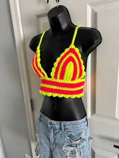 💛Gorgeous, scalloped pattern cropped crochet top, in a vivid, neon, hot pink and safety bright yellow duo of colors! 💛 This shirt GLOWS under black light! Check out the photos!! A fun, pop of neon colors for your summer! You will stand out in this gorgeous crocheted shirt. Perfect for a summer music festival, farmers market, concert, food festival or just a stunning piece for the boho style. Bright, neon duo colors are a show stopper! Crocheted top has an intricate scalloped detail band! These colors are made for each other and are such a bright design.  Shirt is not lined but tight crochet pattern allows for little to no show through. Such a gorgeous, bright and one of a kind shirt, perfect to stand out in a crowd with such a dramatic color combo!  Criss-Cross tie is single crocheted fo Concert Food, Crocheted Shirt, Neon Top, Edm Rave, Summer Music Festivals, Festival Concert, Bright Design, Summer Music, Crochet Crop