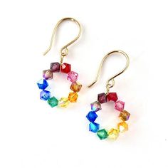 Small Rainbow Swarovski crystal hoop earrings.  Add a little piece of the rainbow to your ears. OVERVIEWSwarovski crystals in every color of the rainbow from red to purple, blue, green, yellow and orange. These beautiful sparkly earrings measure about 1 inch long and are made using high quality aurora borealis swarovski crystals and sterling silver wire.Each pair is individually handmade and will vary slightly in color from pair to pair.More from my rainbow jewelry collection: https://www.etsy.c Crystal Rainbow, Earrings Colorful, Rainbow Jewelry, Rose Quartz Bracelet, Rainbow Bracelet, Crystal Hoop Earrings, Swarovski Crystal Necklace, Sparkly Earrings, Rainbow Earrings