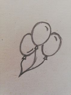 a drawing of three balloons in the shape of a heart on a piece of paper