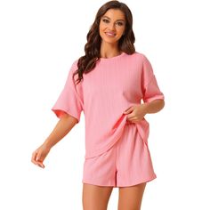 Elevate your lounging experience with the Cheibear Women's Lounge Outfits. This pajama set, featuring a casual round neck top with short sleeves and matching shorts, is crafted from a soft blend of 95% Polyester and 5% Spandex, ensuring both comfort and breathability. The ribbed, solid color design adds a touch of simplicity and style to your relaxation time.

- Material: 95% Polyester, 5% Spandex
- Color: Pink
- Gender: Female
- Size: Small

Ideal for various leisure activities, from sleeping a Spring Sleepwear For Relaxing At Home, Summer Cotton Sleepwear For Relaxing At Home, Comfortable Solid Color Sets For Pajama Party, Casual Ribbed Summer Sets, Soft Spring Sleepwear For Lounging, Soft Texture Sleepwear For Spring Lounging, Comfortable Pink Pajama Shorts For Relaxation, Spring Sleepwear For Loungewear, Soft Spring Loungewear Sleepwear