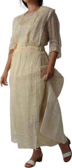 Crisp, cream cotton organdy. Romantic lace details throughout. Concealed snap closure down the front. The early 1900s.MEASUREMENTSShoulder: 15”Bust: 36”Waistband: 30.5“Length: 52.5”SIZE NOTESFits like a medium, possibly large. This piece is clipped in the back for these photos.Seen on 5’2, 34” bust, 28” waist, 39” hipCONDITIONIncredible condition for its age, no major flaws to note. Cream Victorian Dress With Historical Design, Cream Victorian Dress With Lace Trim For Daywear, Victorian Age Dress, 1900s Dress, Vampire Character, Edwardian Era Fashion, Thai Silk Dresses, Hanging Rock, Victorian Age