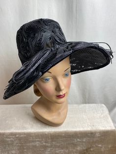 "I just love this hat. It's absolutely beautiful. Very striking, in excellent condition. No flaws noted. Black woven straw type material with a lacy nylon base. A very deep hat with a very wide brim. It's a bit timeless. It has a sheer lacy Look. Breathable. Gorgeous! ✏️ ✏️✏️DETAILS ✏️✏️✏️ Brand: see photo / Flirtette creation New York Size on tag: none Fits like: small (vintage size) Color: black Material: Woven straw & nylon material Condition: excellent Item includes: hat ✂ ✂️✂️ MEASUREMENTS Black High Crown Hat For Evening, Black High Crown Top Hat For Spring, Black Top Hat For Summer Evening Events, High Crown Top Hat For Kentucky Derby Evening, Spring Black Top Hat With High Crown, Black Short Brim Costume Hat For Evening, Black High Crown Top Hat, Royal Ascot Evening Top Hat With Short Brim, Elegant Black Costume Hat With Flat Brim