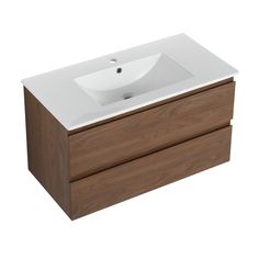 a white sink sitting on top of a wooden cabinet