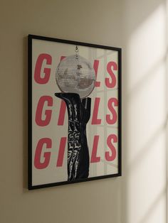 a poster hanging on the wall with a disco ball in it's hand that says girls girls