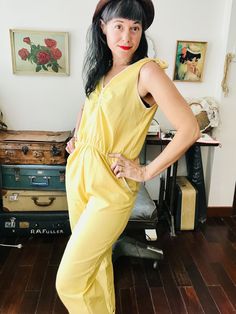 Introducing our fabulous women's jumpsuit in a vibrant yellow linen fabric! This one-piece, 70's style romper is a playful and versatile choice for any occasion. Crafted from soft and breathable yellow linen, this jumpsuit offers both comfort and style. The fabric is not prone to wrinkling, making it a low-maintenance option. Plus, it's machine washable for your convenience. One of the highlights of this jumpsuit is the inclusion of pockets, perfect for storing your essentials while on the go. T Yellow Fitted Jumpsuit Romper Overall, Yellow Fitted Overall Jumpsuit, Fitted Yellow Overall Jumpsuits And Rompers, Spring Cotton Overalls With V-neck, Cotton V-neck Overalls For Spring, Yellow Cotton Overall Jumpsuits And Rompers, Spring Yellow Cotton Jumpsuits And Rompers, Yellow Cotton Jumpsuits And Rompers For Spring, Yellow Fitted Cotton Jumpsuits And Rompers