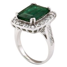 Stamped: 14K White Gold Total Ring Weight: 7.5 Grams Gemstone Weight: Total Natural Emerald Weight is 4.80 Carat (Measures: 13.95x10.20 mm) Color: Green Diamond Weight: Total Natural Diamond Weight is 1.20 Carat Quantity: 30 Color: F-G, Clarity: VS2-SI1 Face Measures: 19.30x16.25 mm Sku: [704023W] Gia Certified Classic Gemstones For Formal Occasions, Classic Platinum Gemstones With Halo Setting, Classic Gia Certified Gemstones For Formal Occasion, Formal Gia Certified Emerald Gemstones, Gia Certified Gemstones For Formal Occasions, Formal Diamond Ring With Prong-set Emeralds, Luxury Emerald Ring With Accent Stones For Formal Occasions, Formal Heirloom Emerald Ring With Halo Setting, Emerald Halo Ring For Formal Occasions