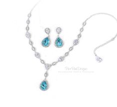 This sparkling bridal necklace featuring Swarovski Light Turquoise Teardrop Crystal, AAA zirconia and rhinestones and finished off with lobster clasp. This gorgeous statement necklace will look elegant and beautiful quality on any modern, classic or vintage inspired bride! Perfect for party, cocktail party and wedding ceremony whether you are the bride or a bridesmaid. All Zirconia shine a lot! Finish: Silver Platinum plated components Swarovski Crystal: Light Turquoise Material: Rhinestones, Sw Backdrop Necklace Wedding, Bridesmaid Gifts Earrings, Crystal Wedding Jewelry, Backdrops Necklace, Crystal Chandelier Earrings, Necklace Bridal, Crystal Light, Necklace Wedding, Light Turquoise