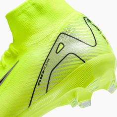 the nike vapor soccer shoe is shown in neon yellow and black, with white lettering on the