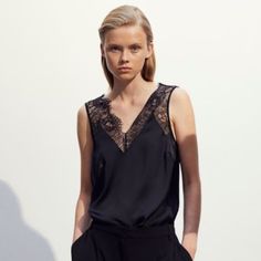 H&M Double V Lace Blouse - Black Sleeveless Top In Satin With A Lace Section At The Top And A V-Neck Front And Back. **Model Showing A Very Very Similar Top. But It’s Not Exact. The Stock Photo From Hm Is The Same Top Though Chic Viscose V-neck Tank Top, Chic Evening Camisole With Lace Top, H&m V-neck Tops For Daywear, V-neck Camisole For Work, Elegant V-neck Camisole For Date Night, Black Sleeveless Viscose Top, Chic Sleeveless Viscose Camisole, Sleeveless Viscose Tops For Night Out, Chic Sleeveless Lace Top Camisole