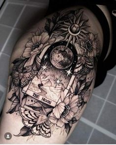 a woman's thigh with sunflowers, moon and stars in the background