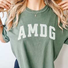 Catholic AMDG Shirt Distressed Catholic Teeshirt Catholic Gift Her Catholic Gift Teen Comfort Colors Shirt Catholic Subtle Catholic Shirt - Etsy Green Cotton T-shirt With Lettering, Comfortable Cotton Tops For College, Cotton Tops With Lettering For Loungewear, Casual College Tops With Lettering, Casual Tops With Lettering For College, Green Top With Lettering And Relaxed Fit, Green Top With Lettering In Relaxed Fit, Green Relaxed Fit Top With Lettering, Catholic Shirt