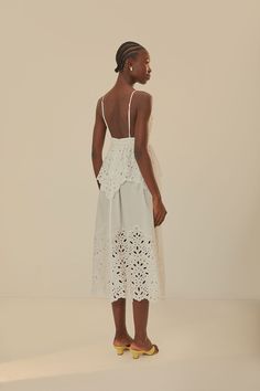 Embrace effortless grace with the White Laise Sleeveless Maxi Dress, showcasing a charming sweetheart neckline and delicate lace detailing. The airy, eyelet fabric creates a beautifully textured silhouette, while the flowing maxi cut sways with every step. This dress radiates a timeless elegance, perfect for sun-soaked days or enchanting evenings. Its romantic allure is completed with slender adjustable straps, ensuring a perfect fit for your breezy adventures. Composition 100% COTTON Care Instr White Lace Dress With Ruffles And Spaghetti Straps, White Sleeveless Lace Dress With Lace Bodice, White Sleeveless Lace Dress With Scalloped Lace, White Dress With Cutwork Hem For Garden Party, Summer Wedding Dress With Eyelet Details, Summer Sleeveless Broderie Anglaise Dress, Elegant Eyelet Beach Dress, White Lace Dress With Sweetheart Neckline For Summer, Sleeveless Lace Eyelet Dress