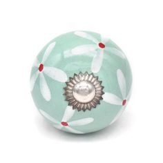 a green ball with white and red designs on it's side, sitting against a white background