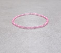 These are cute size 11/0 Japanese Transparent Matte Pink stretch seed bead bracelets! You'll receive one bracelet per transaction!  Stretch seed bead bracelets are made on elastic cord, so these bracelets stretch then slide over your hand! It's your choice of how you'd like your bracelets to fit based on your wrist size, and the size options given! (Please measure your wrist accordingly!) These seed beads are size 11/0 so they're super tiny, and the beautiful colors of the seed beads I use pack Bracelets Dainty, Matte Pink, Bead Bracelets, Seed Bead Bracelets, Drawstring Pouch, Seed Bead, Seed Beads, Beautiful Colors, Jewelry Bracelets