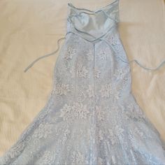 Nwot Very Pretty And Very Long Floral Blue Lace Mermaid / Trumpet Gown With Criss Cross Straps Across An Open Back. All Tags Removed, But Is Very Similar To The Azazie Maldive Dress In Sky Blue. Measurements Are Shown In Pictures. The Dress Is Very Long And Will Likely Need To Be Hemmed If The Wearer Is Under 6ft Tall With Their Desired Shoes On. No Size Tag Included, But Seems To Be About A 4. Baby Blue Dress Formal, Prom Dresses 2000s, Unique Long Dresses, Light Blue Homecoming Dresses, 90s Wedding Dress, Winter Formal Dress, Blue Dresses For Women, Mermaid Board, Elegant Prom Dress