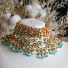 Choose from a wide variety of hues and textures. We've created the ultimate bridal accessory. Beautifully embroidered with a soft pastel tone, this handmade necklace is a charming choice for a bride-to-be. Multicolor Handmade Choker For Wedding, Multicolor Intricate Design Necklace For Wedding, Multicolor Intricate Wedding Necklace, Multicolor Intricate Design Wedding Necklace, Wedding Multicolor Intricate Design Necklace, Handmade Bollywood Necklaces For Wedding, Handmade Bollywood Style Necklaces For Wedding, Handmade Chandbali Necklace For Weddings, Handmade Kundan Bridal Necklace For Reception