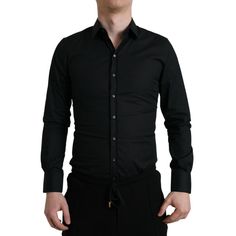 Discover The Epitome Of Italian Craftsmanship With This Exquisite Dress Shirt From Dolce & Gabbana. Known For Their Sophisticated Design Touch, This Piece Is No Exception. It’s Woven From A Luxurious Blend Of Materials That Offers Both Comfort And A Silky Touch, Making It Perfect For Any Formal Or Upscale Occasion. With Its Sleek Black Hue And Slim Fit, It’s Designed To Impress And Elevate Your Ensemble Effortlessly. Details:Color: Blackmaterial: 70% Cotton, 23% Nylon, 7% Elastanefitting: Slim F Designer Fitted Shirt For Business, Designer Fitted Tops For Business, Designer Black Shirt For Business, Designer Black Business Tops, Designer Black Tops For Business, Designer Fitted Black Shirt, Designer Black Semi-formal Top, Designer Black Tops For Semi-formal Occasions, Designer Black Shirt With Spread Collar