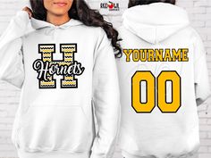 Personalized Hornet School Spirit T-Shirt Crewneck, Hoodie Hooded Sweatshirt Football, Baseball, Basketball, Softball, Track, Volleyball, Cross Country, Cheer, Wrestling Not all colors are available in all sizes and styles.  Please check the color and size charts in photos. We do our best to accurately represent shirt colors by using actual photos but do understand that all monitors will display differently. Please contact us prior to purchase with any questions on sizing or colors. Your purchase includes a custom imprint created specifically for your team! A product proof will be emailed to you within 1 business day.  Please keep an eye on your Etsy messages and reply with any changes within 24 hours. Your order will be sent to production after that time if no response is received. Excess Cheer Football, Represent Shirt, Hornet, Grey Shirt, School Spirit, Cross Country, Size Charts, Sweatshirt Hoodie, Mom Dad