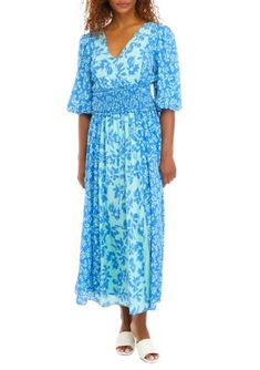 A smocked waist flatters this puff-sleeved floral midi dress from Taylor. | Taylor Women's Elbow Sleeve V-Neck Smocked Waist Floral Print Midi Dress, 2 Summer V-neck Midi Dress With Smocked Cuffs, Spring Smocked Dress With Elastic Waistband For Brunch, Spring Blue Midi Dress With Elastic Waistband, Spring Smocked Dress With Elastic Waistband For Daywear, Spring Midi-length Smocked Dress With Elastic Sleeves, Midi Dress With Smocked Cuffs For Vacation, Casual Midi Dress With Elastic Sleeves For Spring, Floral Print Midi Dress, Print Midi Dress