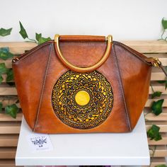 About: Beautiful structured bag crafted from authentic leather and embossed with a striking mandala design. A chic, structured, tote-shaped bag that will hold life's essentials in style. Specs: Size: 35x22x15cm/14"x9"x6' Elegant Embossed Top Handle Shoulder Bag, Embossed Bags With Double Handle For Daily Use, Elegant Embossed Tote Bag, Embossed Double Handle Shoulder Bag For Everyday Use, Embossed Double Handle Bag For Daily Use, Embossed Double Handle Shoulder Bag, Double Handle Embossed Shoulder Bag For Daily Use, Daily Use Embossed Bags With Double Handle, Daily Use Double Handle Embossed Shoulder Bag