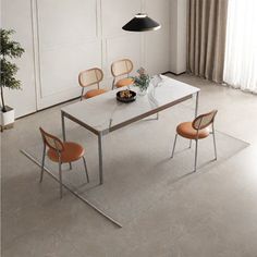 a dining table with four chairs and a potted plant in the middle on top