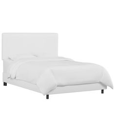 a bed with white sheets and pillows on top of it, against a white background