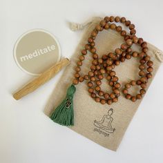 Spiritual Wooden Beads Mala For Meditation, Holistic Healing Mala With Wooden Beads, Holistic Wooden Beads Mala For Rituals, Holistic Wooden Mala For Rituals, Spiritual Brown Mala For Healing, Spiritual Brown Mala For Meditation, Brown Spiritual Mala For Meditation, Bohemian Hand Wrapped Mala For Meditation, Brown Hand Knotted Mala For Healing