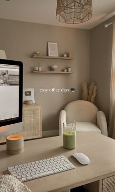 a computer monitor sitting on top of a wooden desk