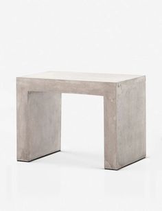 a white table with a square shaped design on it's top and bottom edge