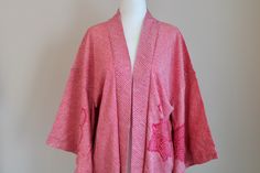 🌸Vintage Haori Pink Kimono Jacket in medium weight silk crepe with a beautiful flower and plant pattern. Traditional Japanese floral pattern lining.  🌸MEASUREMENTS taken lying flat : Width : (sleeve to sleeve) 126 cm/49 in (pit to pit) 60 cm Length : (total) 76 cm/30 in (sleeve drop) 47 cm 🌸MATERIAL: Japanese Silk 🌸CARE : dry clean recommended 🌸CONDITION: vintage and excellence condition. All kimono are originally made in Japan.  🌸COLOR: All my pictures are taken with natural light, please refer to the photos and video for best idea of the actual color. 🌸SHIPPING: FREE domestic shipping & Fast ships from USA. If you are buying multiple pieces, please message me I'll combine shipping. 🌸Please note that vintage kimono are not always flawless and might have some blemishes (I will try Red Vintage Kimono For Spring, Red Vintage Cotton Kimono, Vintage Red Cotton Kimono, Pink Kimono Traditional, Long Kimono Jacket, Kimono Traditional, Silk Kimono Jacket, Fashion Japanese, Pink Kimono