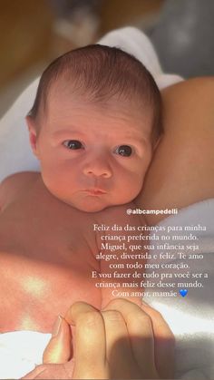 a woman holding a baby in her arms with the caption'feliz dia crimeos para milha '