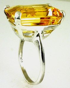 ALL OUR JEWELRY IS HANDCRAFTED IN THE U.S.A. IF YOU NEED THIS ITEM FOR A SPECIAL OCCASION LET US KNOW AND WE WILL TRY TO EXPEDITE THE ORDER. This fine quality richly colored Bolivian Citrine with a wonderful golden -yellow hue set in a bold, traditional design. This is a comfortable solitaire ring made of solid 925 sterling silver. This is a great everyday ring that you'll wear everywhere, from the grocery to date night. makes a perfect gift. Citrine is the Birthstone for November. (1) Citrine, Formal Yellow Solitaire Jewelry, Yellow Topaz Ring With Center Stone For Formal Occasions, Formal Yellow Topaz Ring With Center Stone, Formal Solitaire Citrine Jewelry, Formal Citrine Solitaire Jewelry, Yellow Faceted Fine Jewelry Rings, Fine Jewelry Yellow Faceted Ring, Formal Solitaire Topaz Ring, Yellow Octagon Wedding Ring