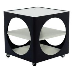 a black and white cube table with wheels