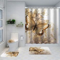 a bathroom with a shower curtain, toilet and rugs in the shape of butterflies