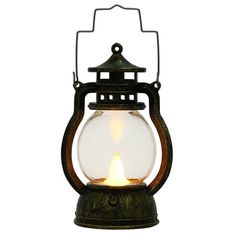 an old fashioned lantern with a lit candle inside on a white background, close up