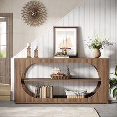 a wooden shelf with books and vases on it in front of a stair case